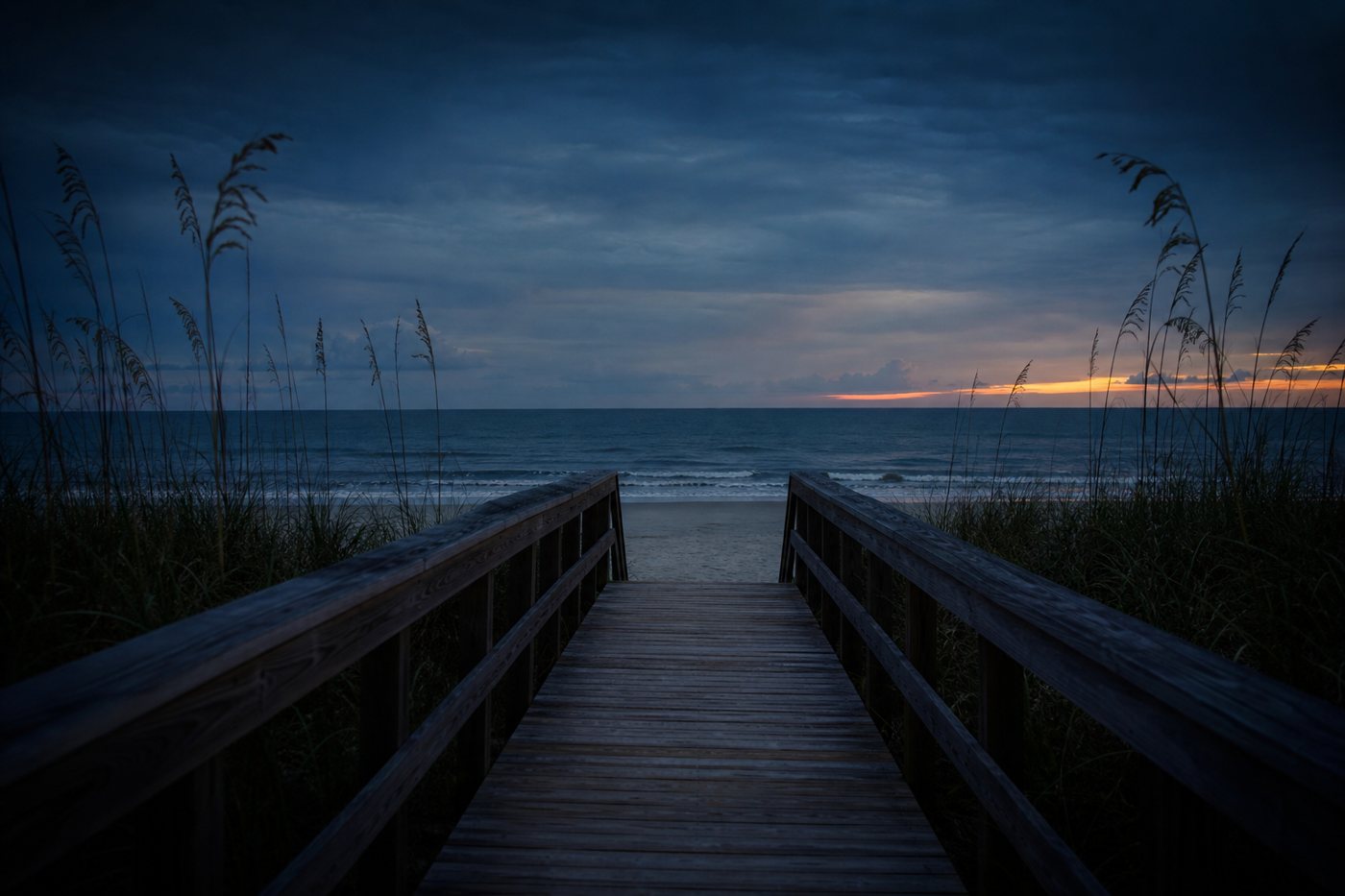 Boardwalk leading to the Gulf of Mexico at dusk, AI-generated representative image